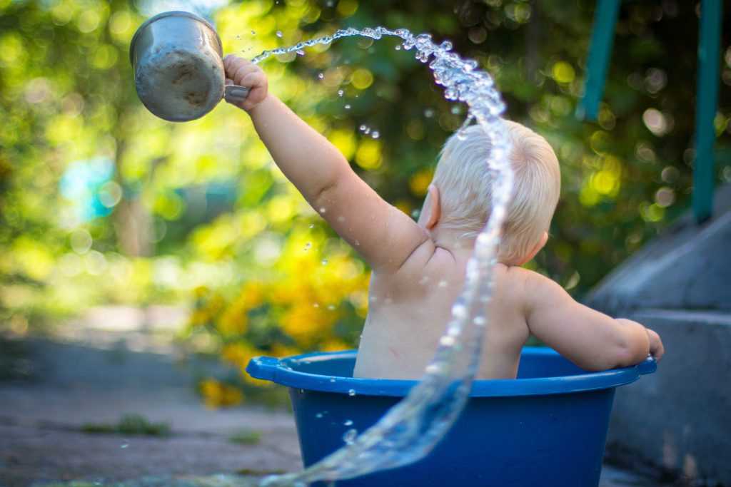 Baby throwing out bathwater